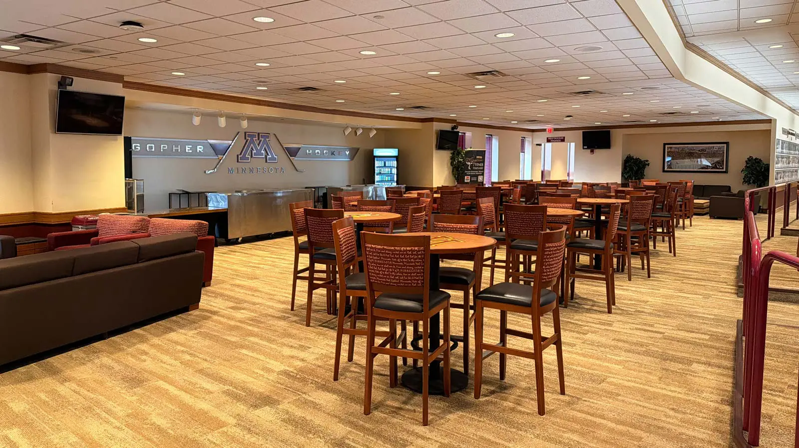 Conference tables in a room with Tvs