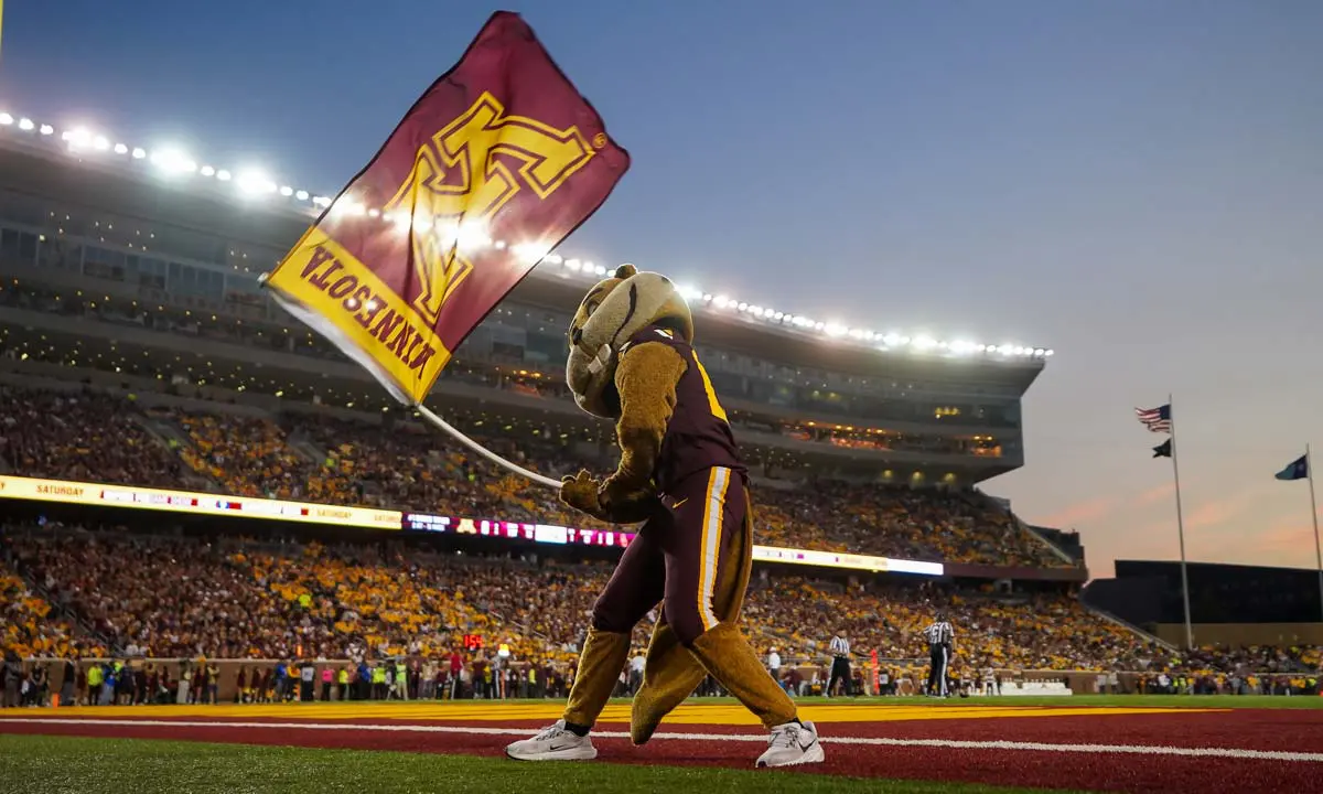 Goldy gopher in costume waving and smiling