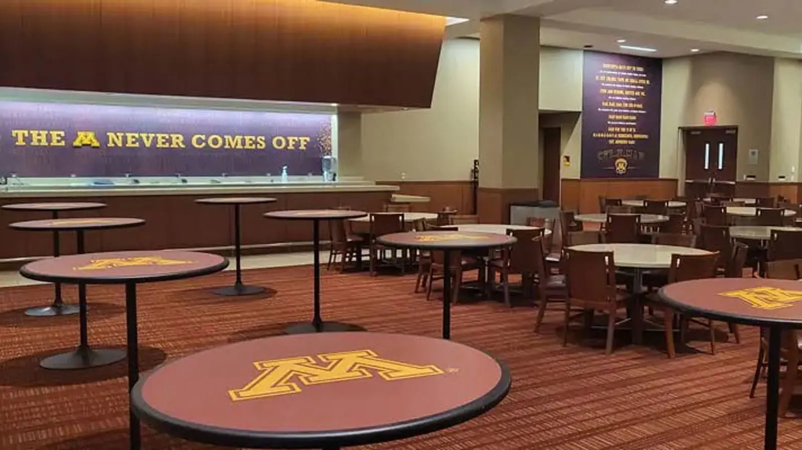 Conference tables in a room with Tvs