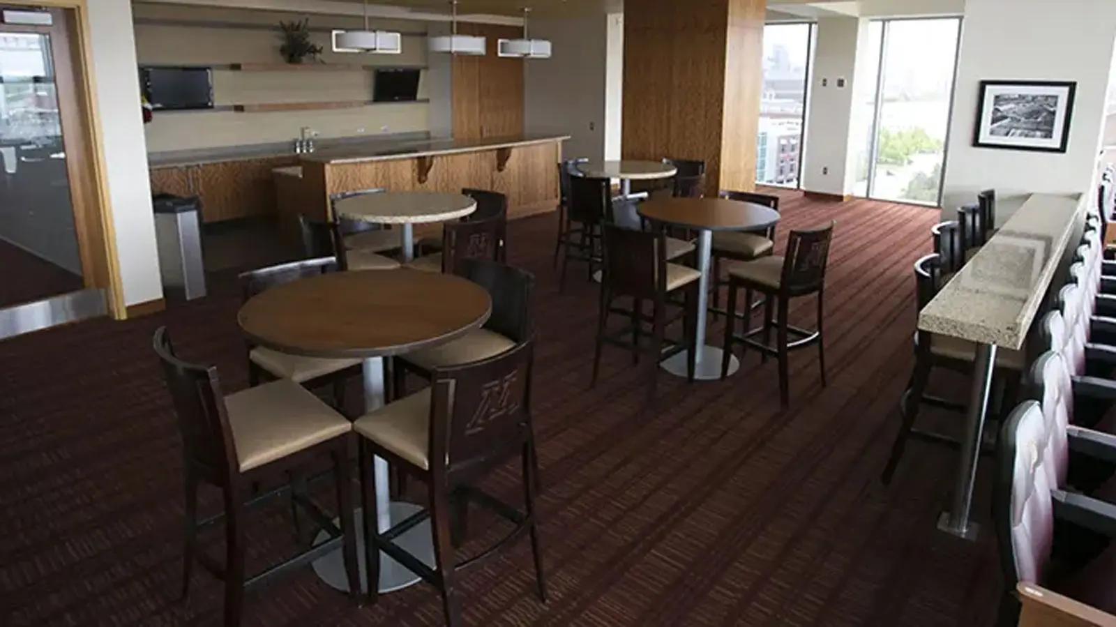 Conference tables in a room with Tvs