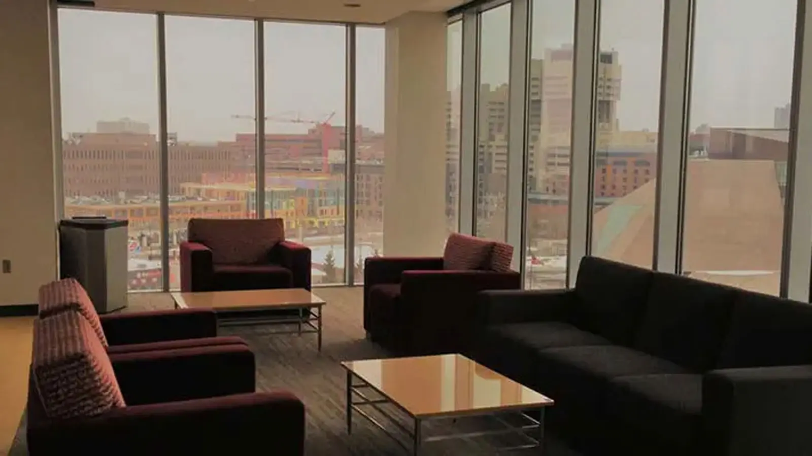 Conference tables in a room with Tvs