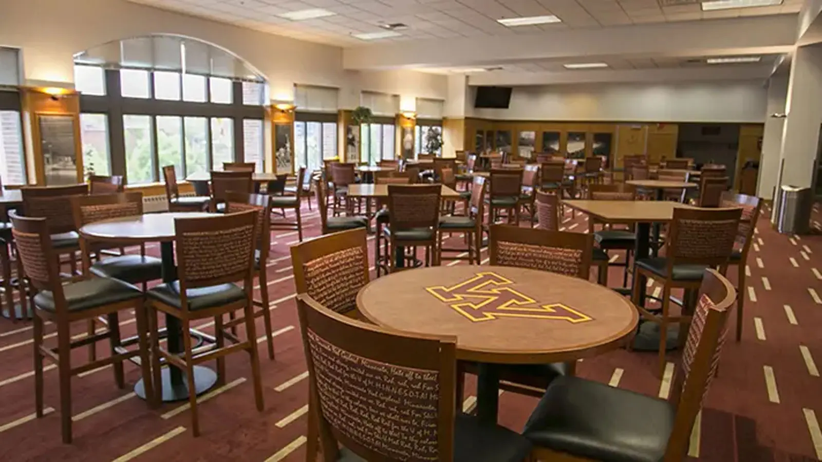 Conference tables in a room with Tvs