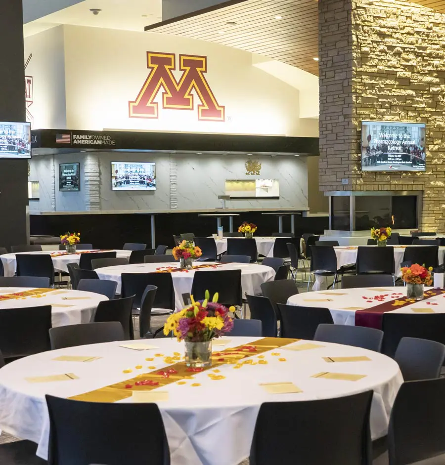 Conference tables in a room with Tvs