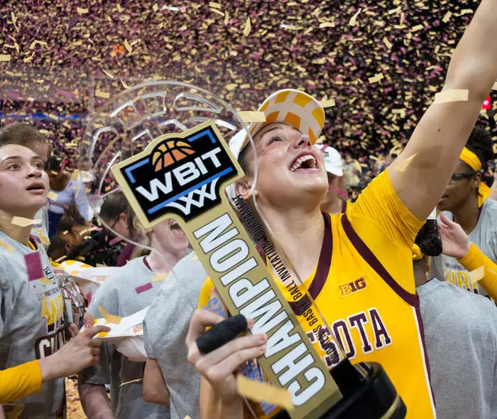 Athlete holding trophy