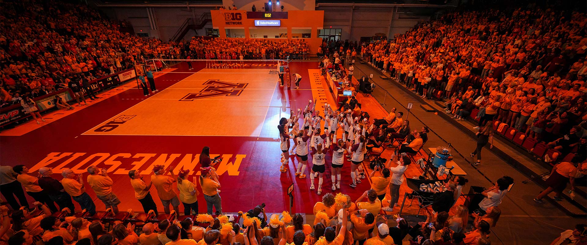 Fans in stands at volleyball game