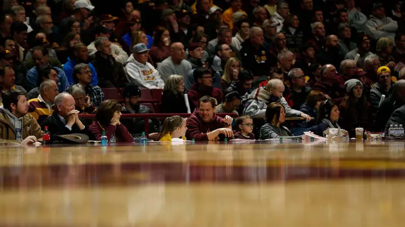 View of fans watching game from court level